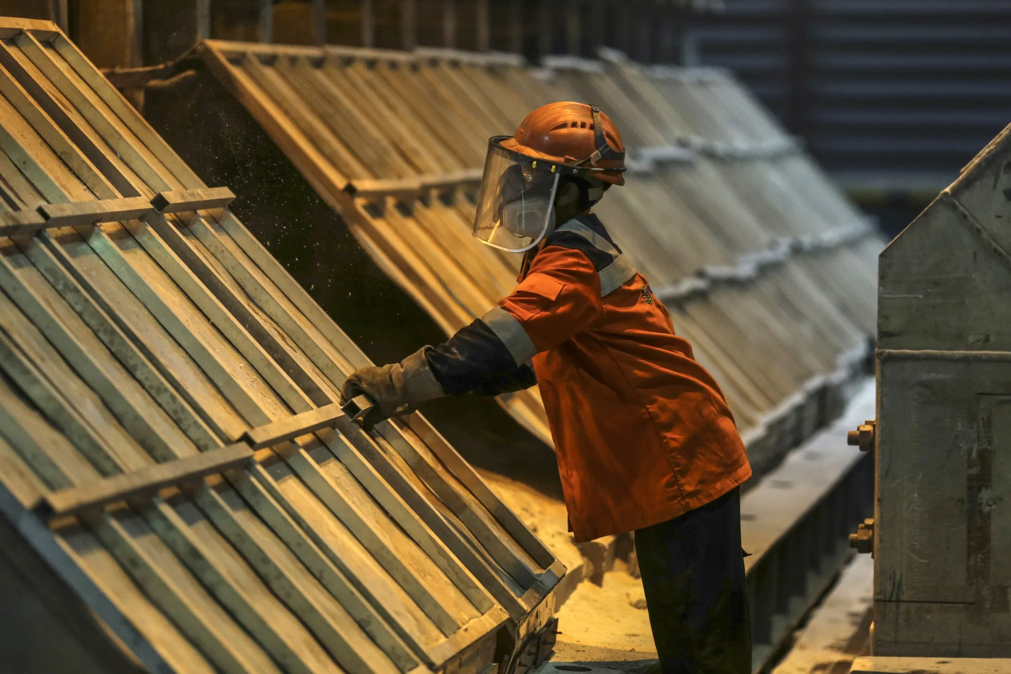An employees works at an Aluminium Smelter in&nbsp;India.