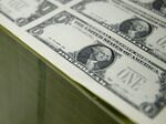 50 subject one dollar note sheets sit in a stack before receiving a serial number and the U.S. Treasury and U.S. Federal Reserve seals at the U.S. Bureau of Engraving and Printing in Washington, D.C., U.S., on Tuesday, April 14, 2015. Republican efforts to pass a fiscal year 2016 budget cleared another hurdle as the House named its members to a conference committee and Senate Majority Leader Mitch McConnell pledged to do the same by the end of the week.