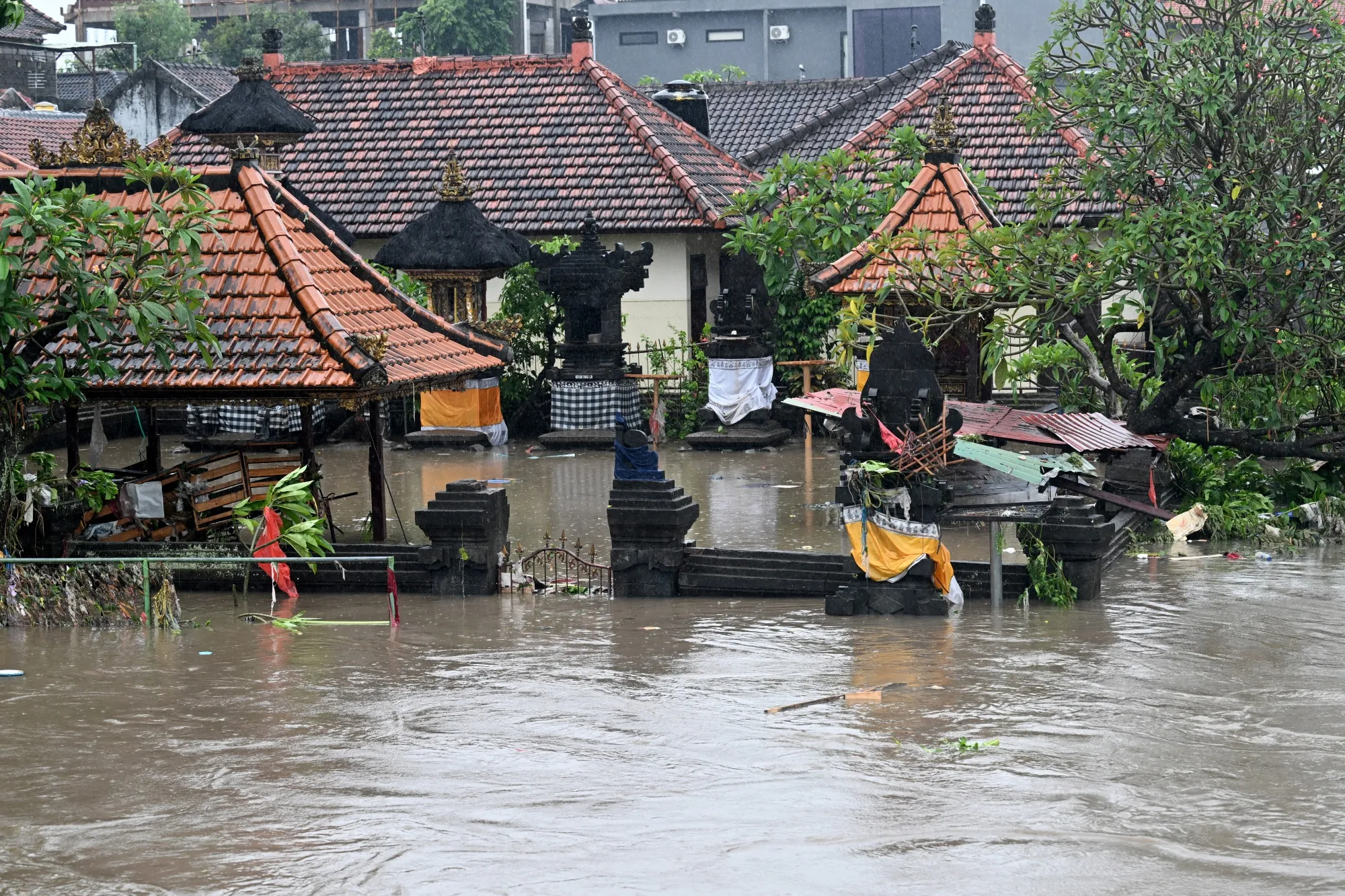 A Hindu temple is inundated by floodwaters following heavy rain in Denpasar, Bali on Sept. 10.