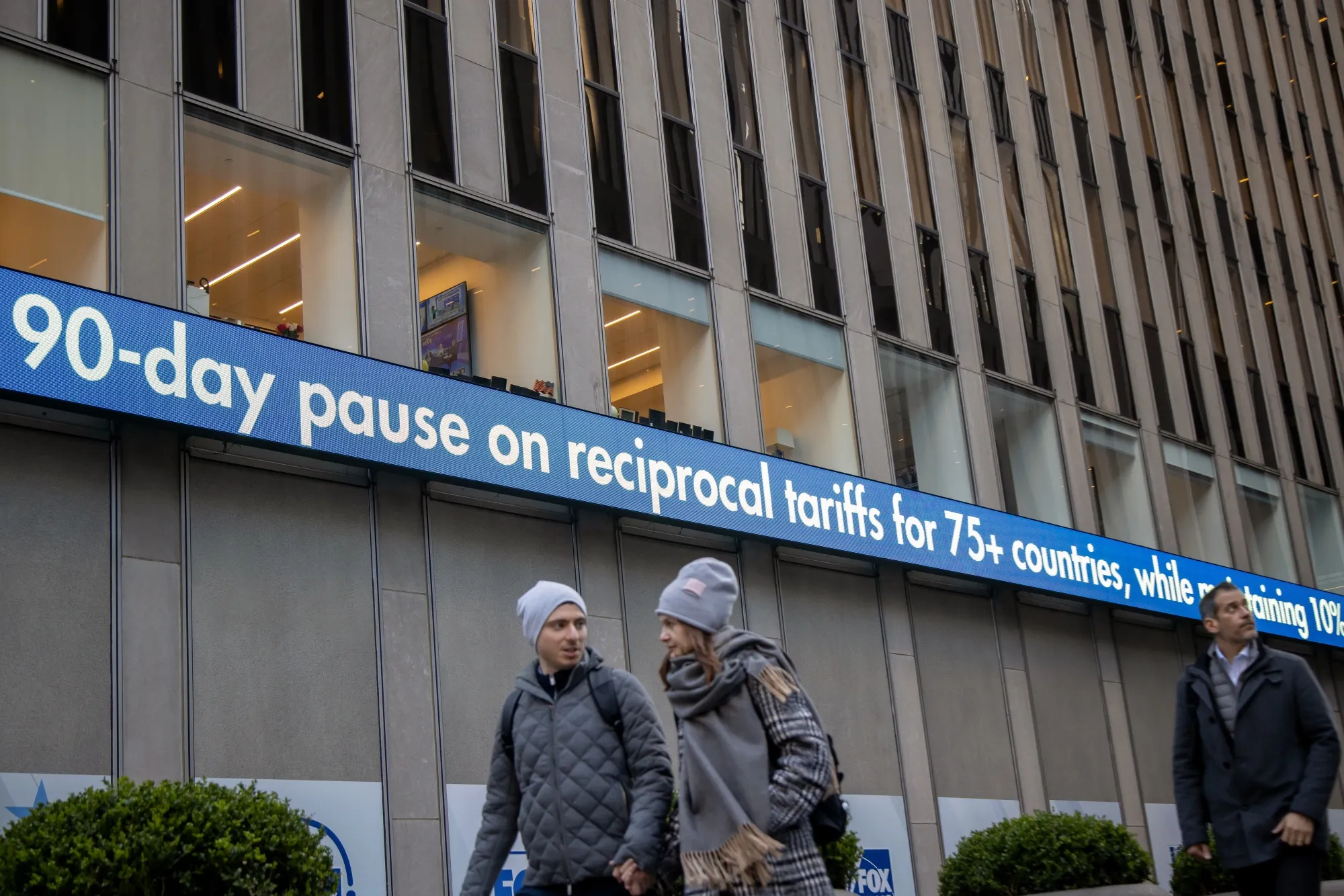 A news ticker displays tariff news on the News Corp. building in New York, US, on Wednesday, April 9, 2025.&nbsp;