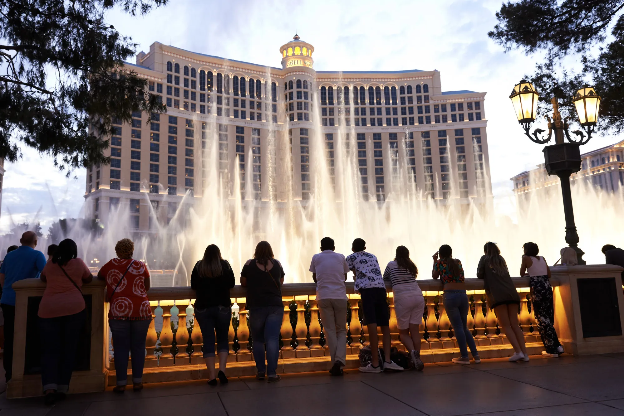Tourists view the water fountains at the Bellagio Resort & Casino in Las Vegas.
