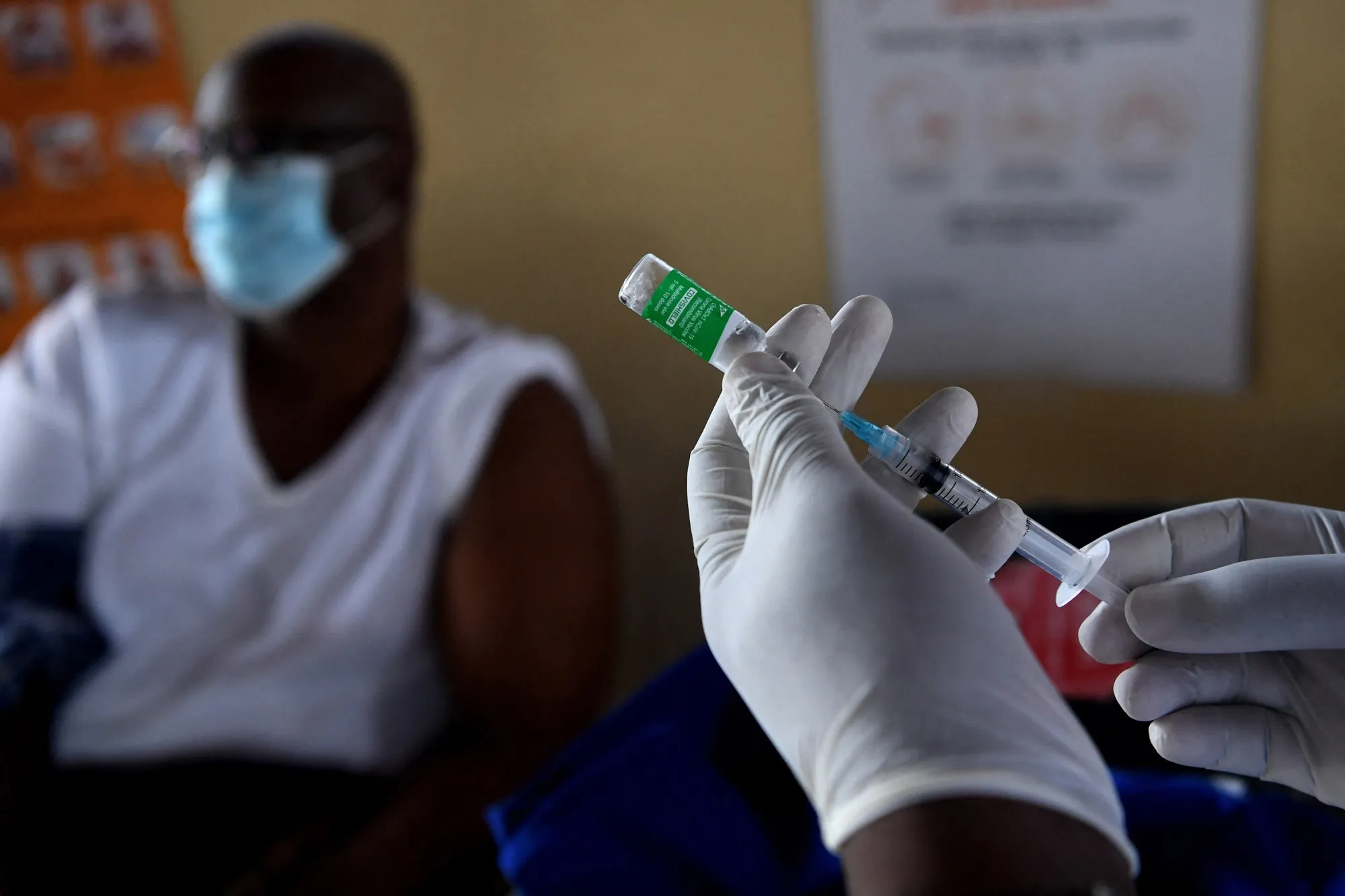 A health worker prepares a dose of the Oxford/AstraZeneca COVID-19 vaccine in Francistown, Botswana.