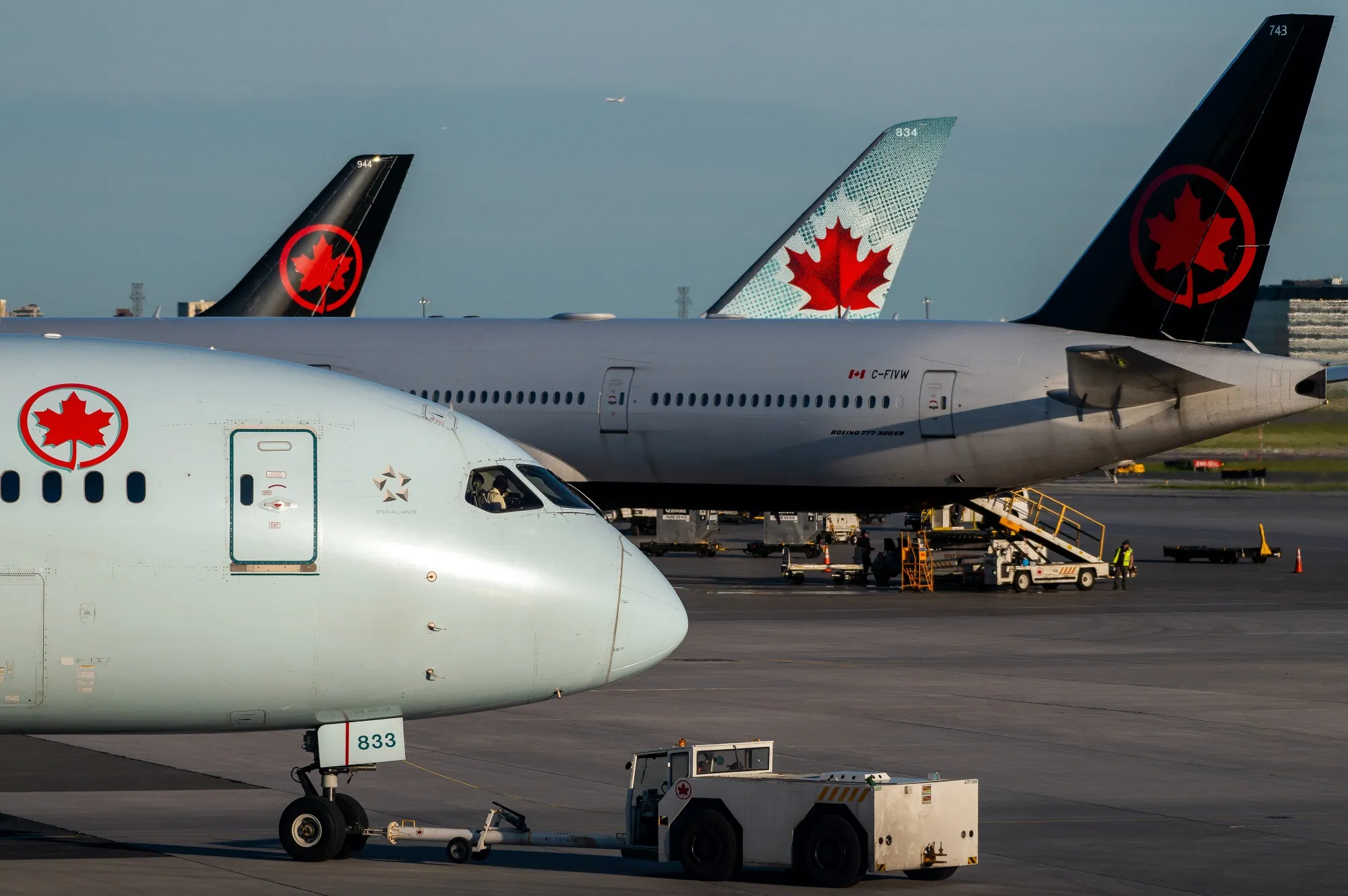 Air Canada planes on the tarmac at Toronto Pearson International Airport.