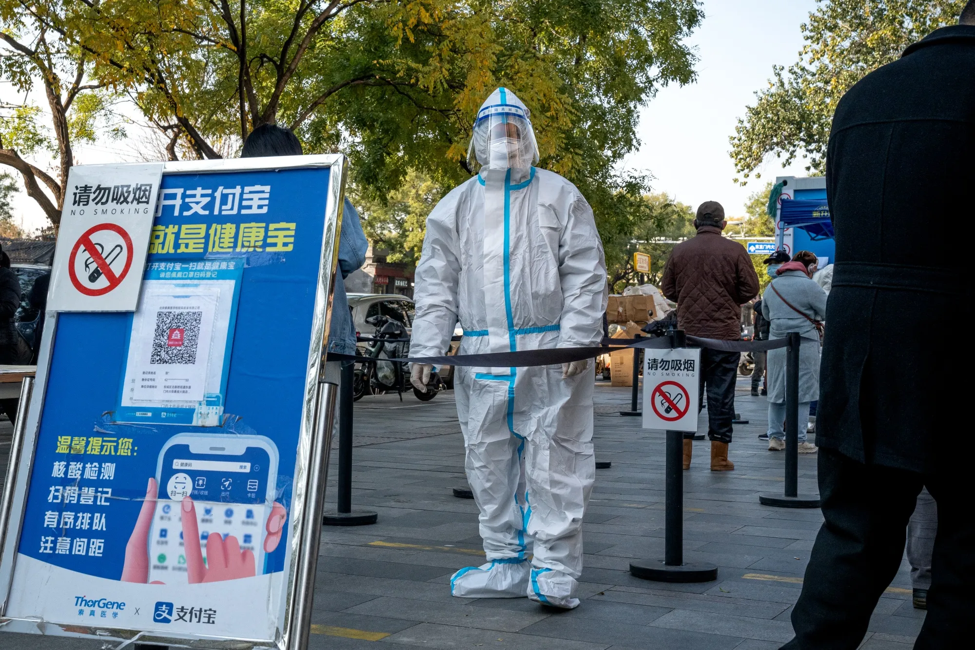 A worker in protective gear at a Covid-19 testing booth in Beijing on&nbsp;Nov. 14.