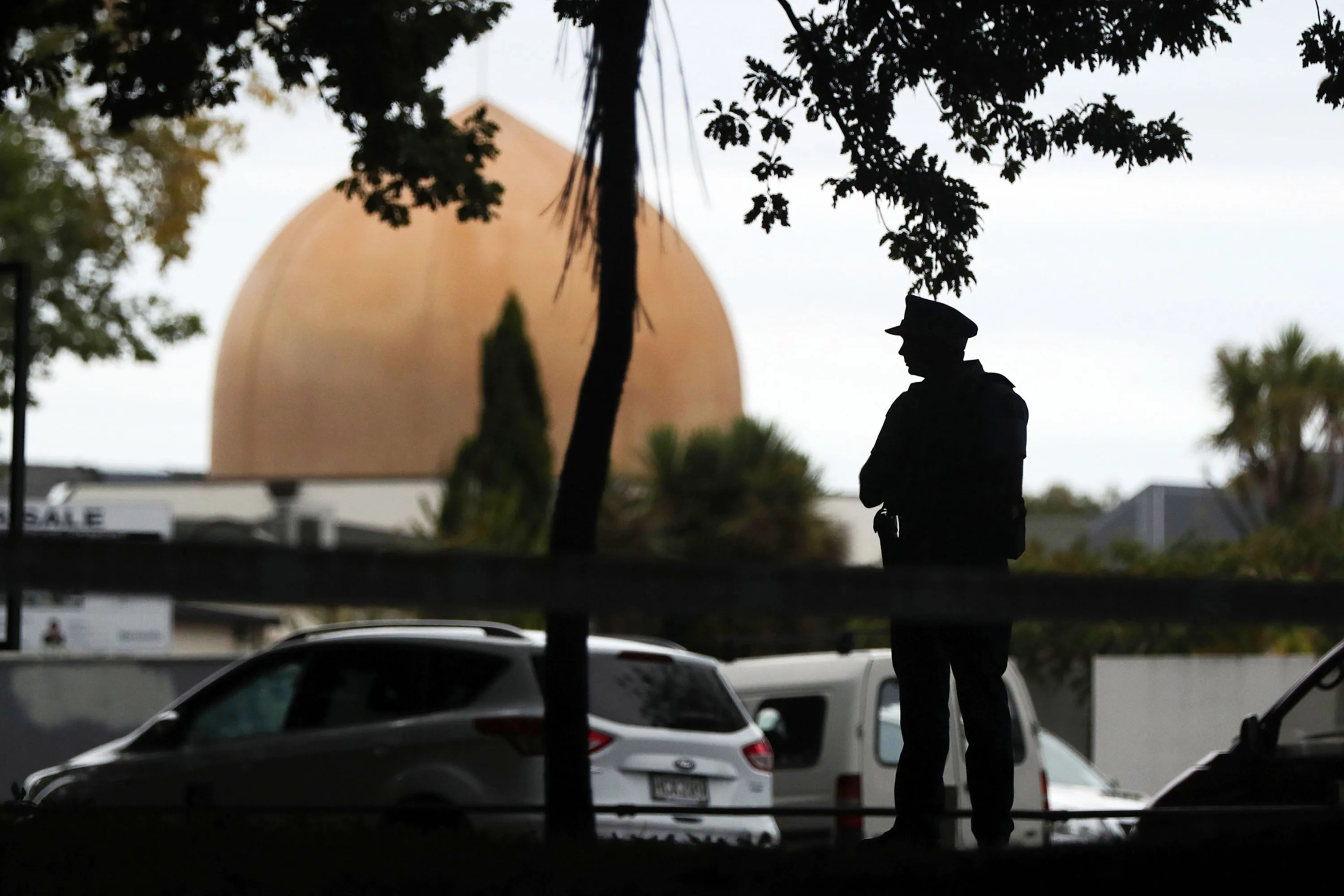 A police officer&nbsp;stands guard in front of the Masjid Al Noor Mosque in Christchurch on March 16.