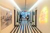 Members walk through the lobby of the WeWork Cos Inc. 85 Broad Street offices in the Manhattan borough of New York, U.S., on Wednesday, May 22, 2019. WeWork has become the biggest private office tenant in London, Manhattan and Washington on its way to 425 office locations in 36 countries overall.