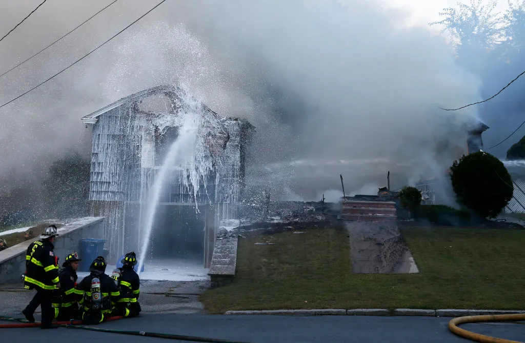 Crews work to knock down a fire on Jefferson Street in Lawrence, Mass. on Sep. 13.&nbsp;