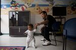 James Hernandez and his 1-year-old daughter, Xy-lena, are living in a family shelter in Los Angeles. Hernandez moved to California from Houston in search of work. 