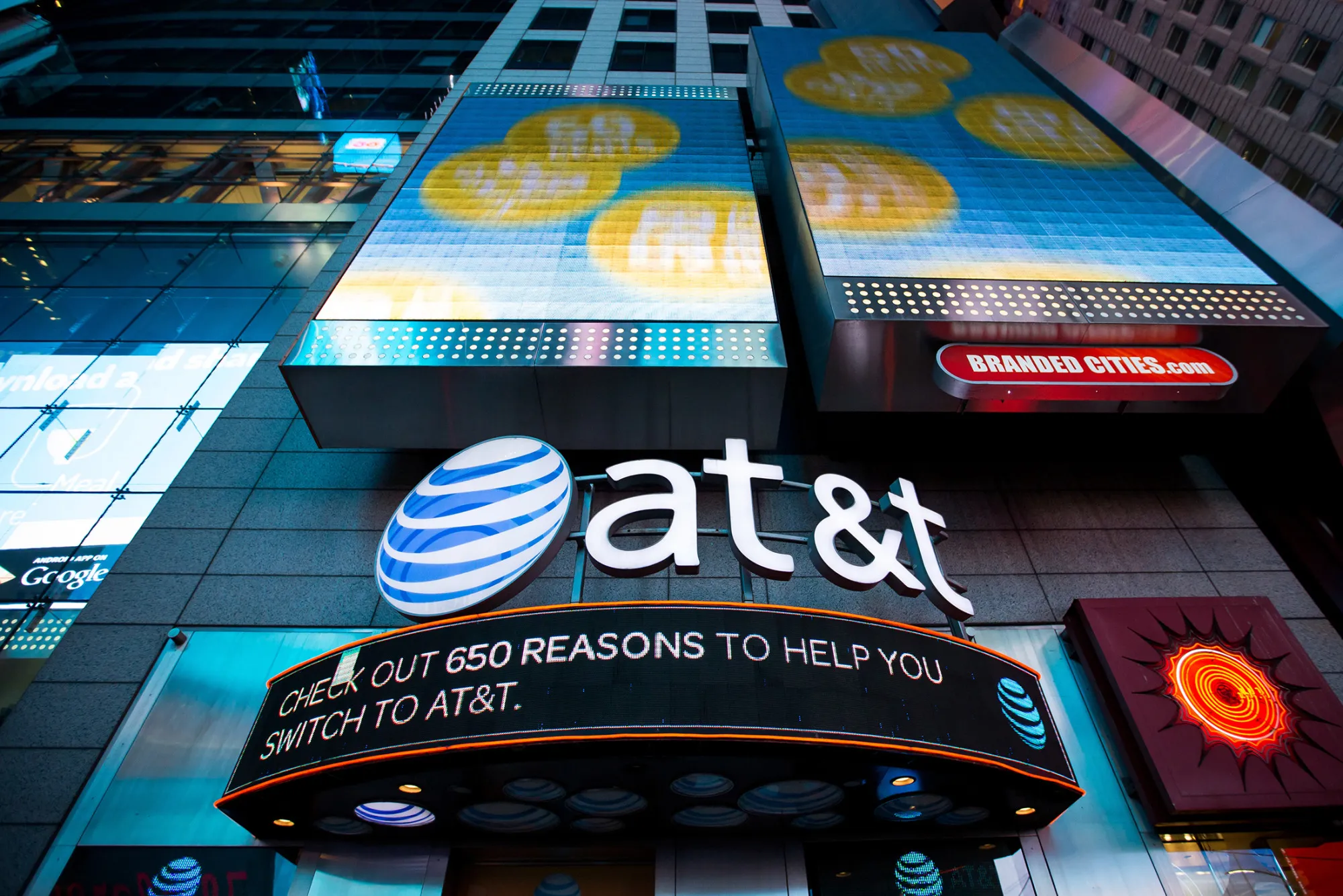 AT&T Inc. signage is displayed at the company's store in the Times Square area of New York, U.S.