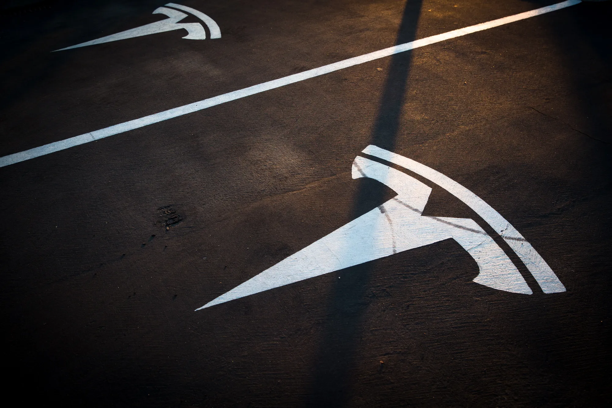 A Tesla logo in an empty parking bay at a Supercharger station, Sant Cugat, Spain, July 10, 2019.