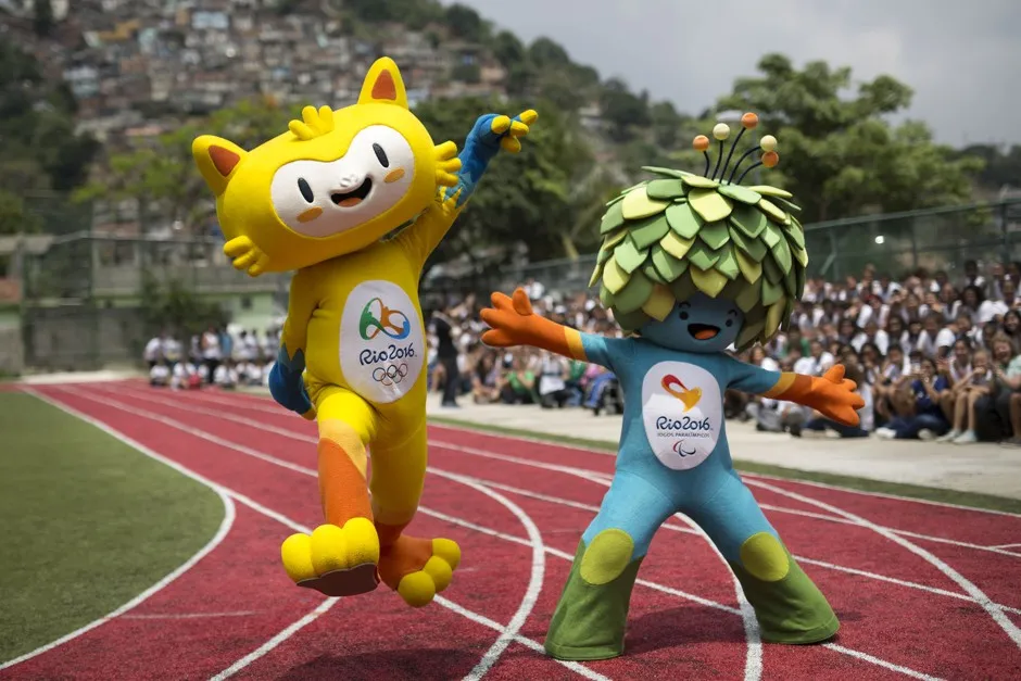 The mascots of the Rio 2016 Olympics, left, and Paralympic Games make their first official appearance at a public school in the Santa Teresa neighborhood of Rio de Janeiro, Brazil, Monday, Nov. 24, 2014.