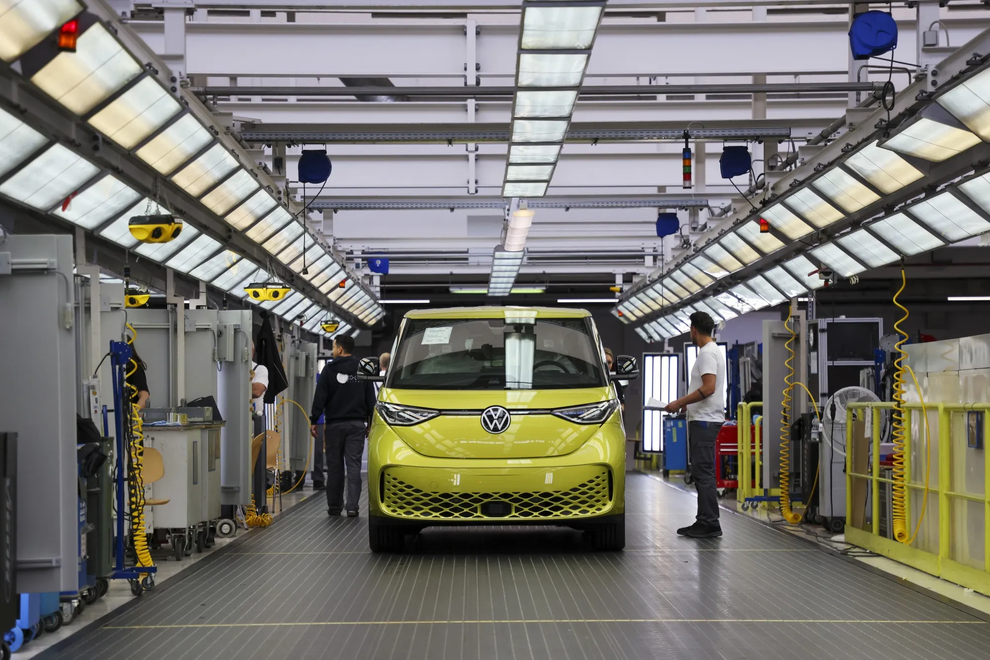 Employees work on Volkswagen ID Buzz electric microbus vehicles in Hannover, Germany.&nbsp;