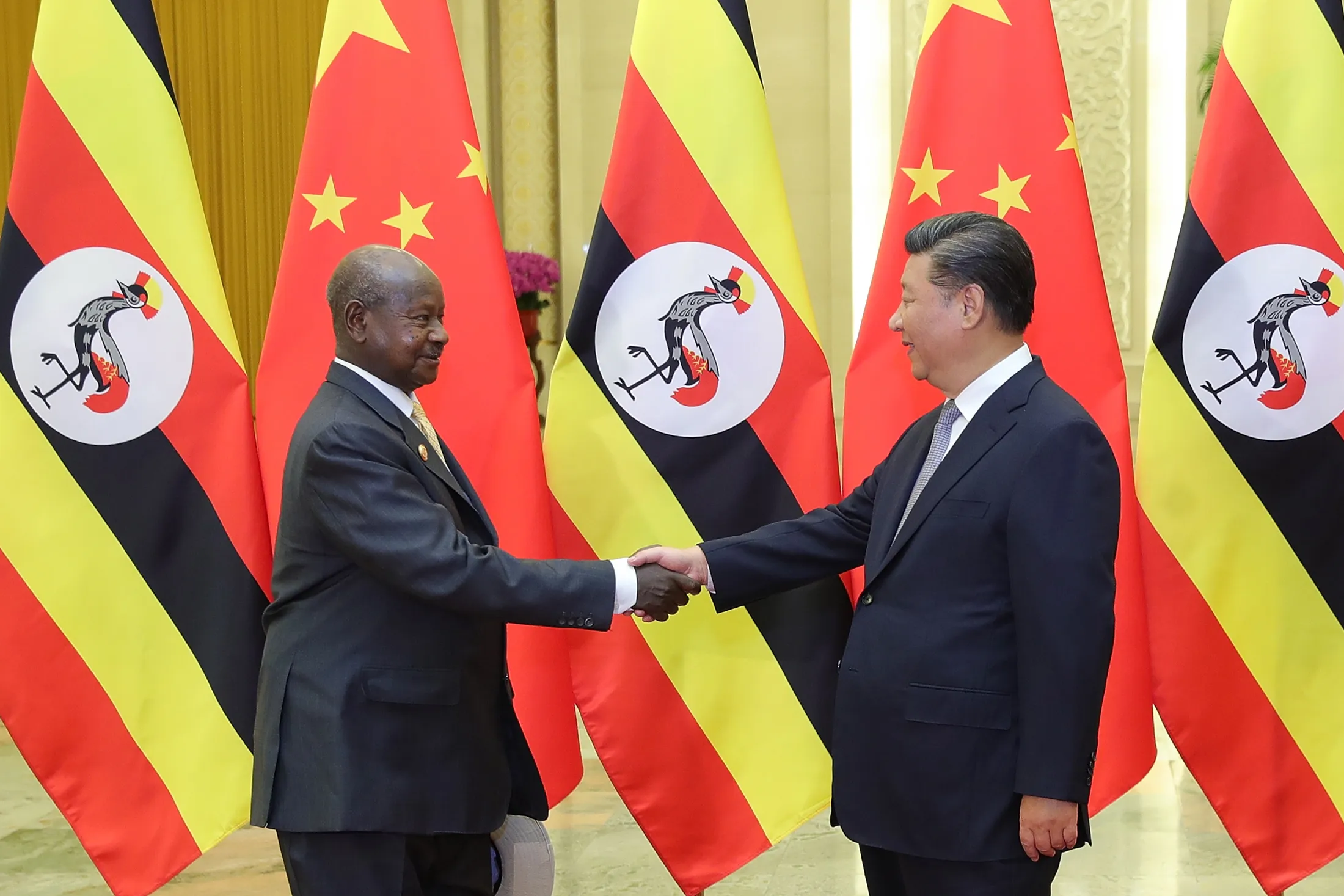 Xi Jinping, right, and Yoweri Museveni in 2018.
