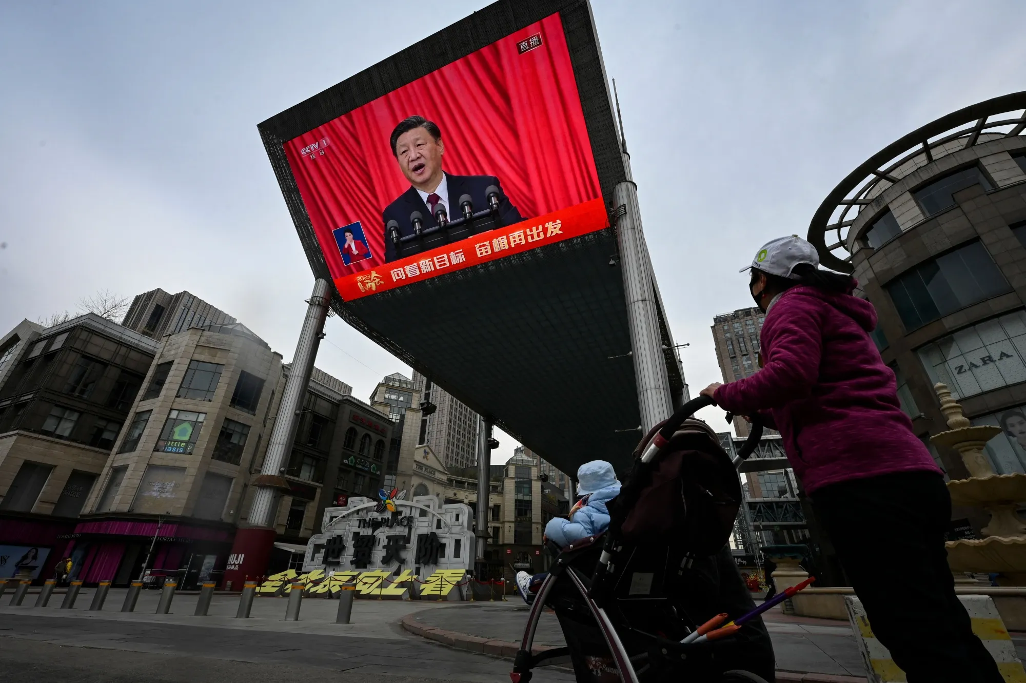 A&nbsp;screen shows a live&nbsp;coverage of Chinese President Xi Jinping delivering a speech&nbsp;on March 13.