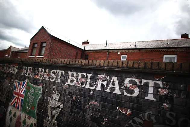 A faded mural is seen near housing in the mainly Protestant area of east Belfast, Northern Ireland, in 2011