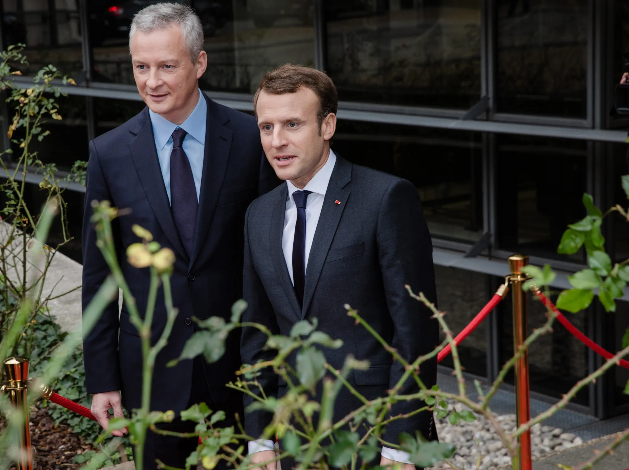 Emmanuel Macron, France's president, right, stands with Bruno Le Maire, France's finance minister