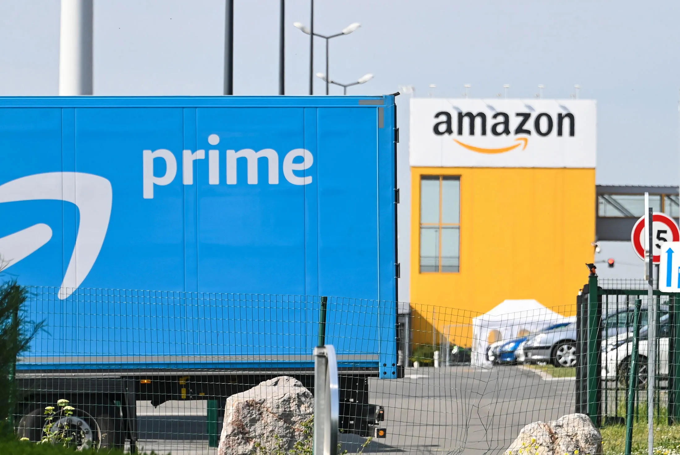 An Amazon delivery lorry is parked outside the Amazon logistics centre in Lauwin-Planque, France, on April 16.