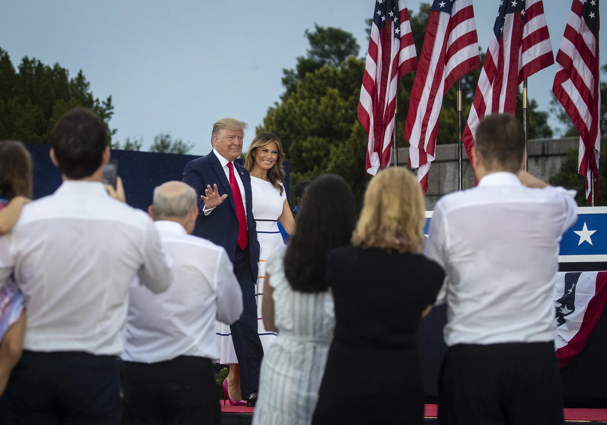 Donald Trump and Melania Trump arrive at the Fourth of July event.