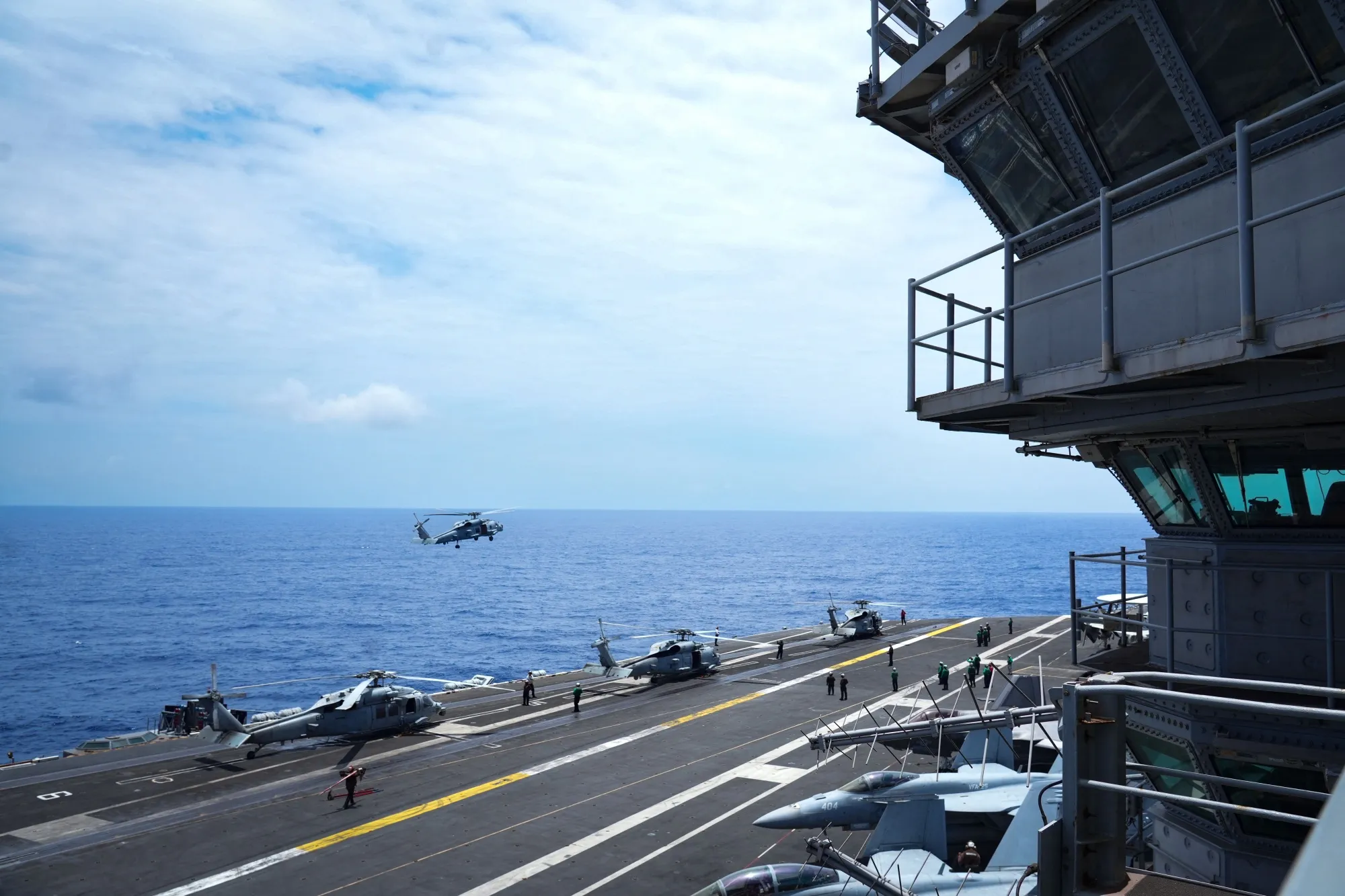 A military helicopter approaches for landing on the aircraft carrier USS Theodore Roosevelt in the Pacific Ocean near Hawaii in July.
