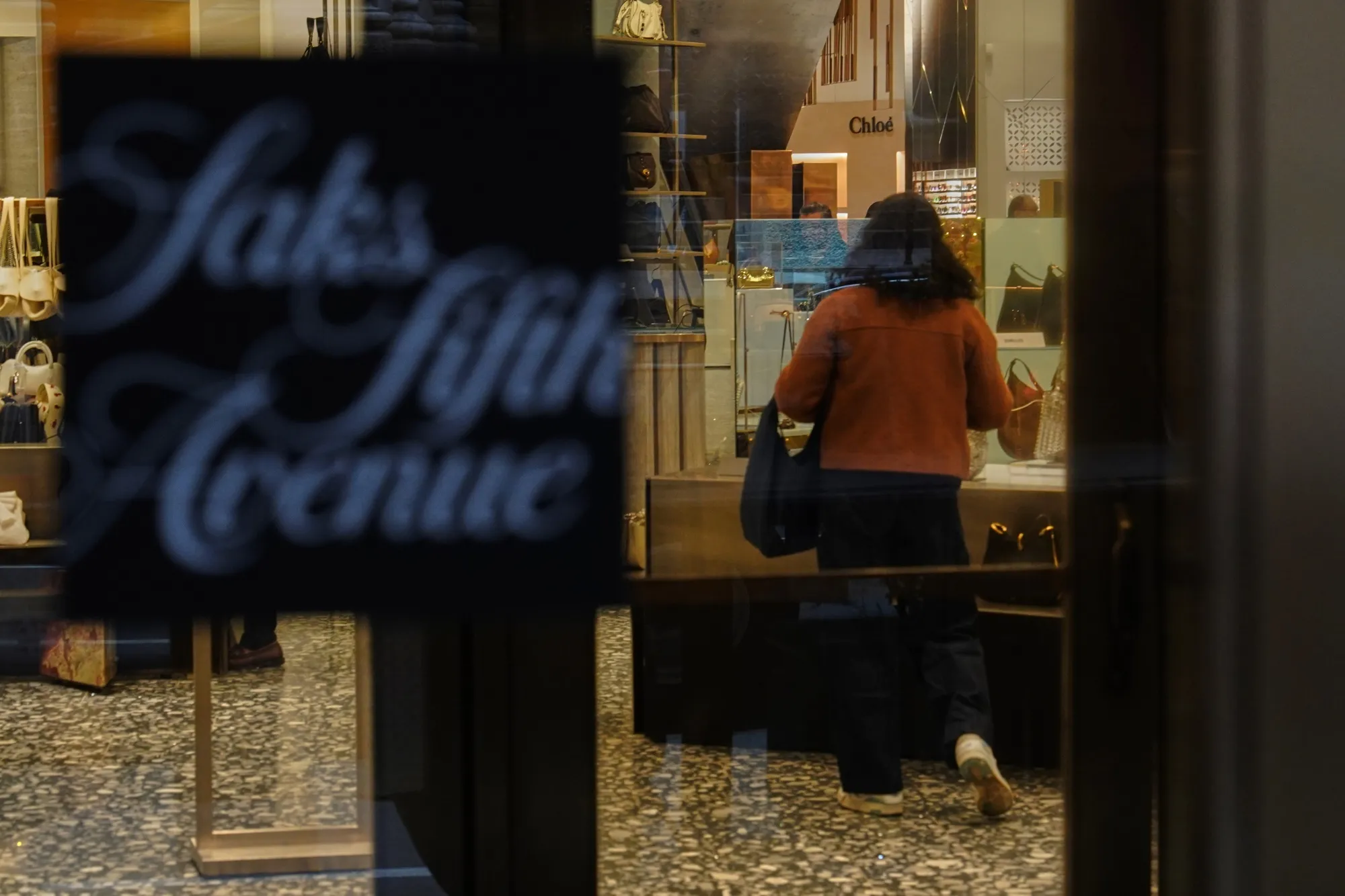 A shopper inside a Saks Fifth Avenue store in New York.