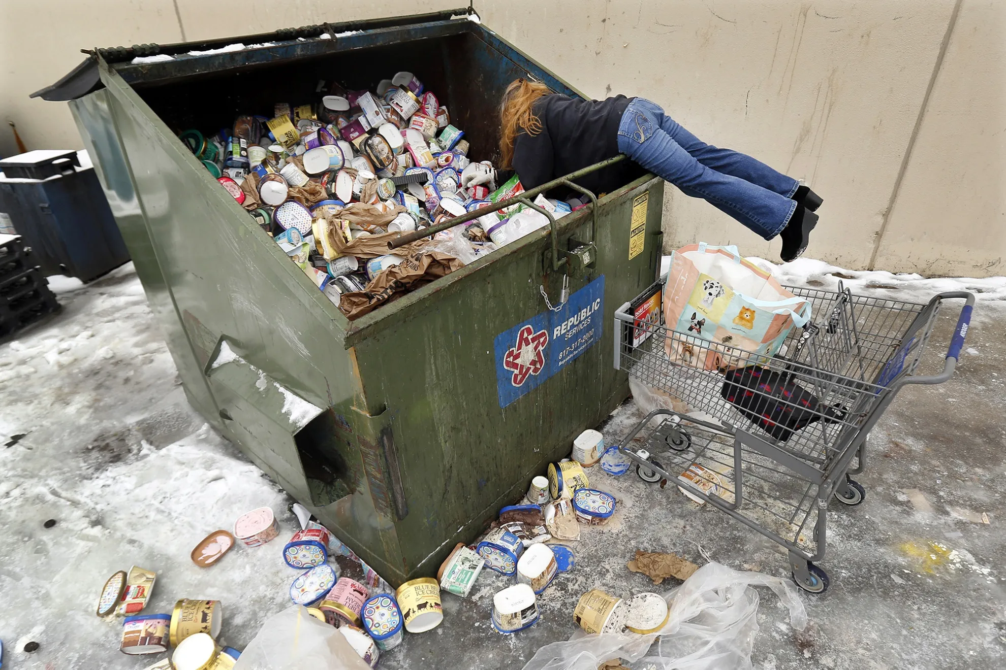 Dumpster full of thrown out ice cream at a supermarket in Arlington, Texas on&nbsp;Feb. 17.