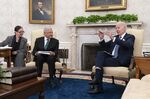 US President Joe Biden speaks with Andres Manuel Lopez Obrador, Mexico's president, center, during a meeting in the Oval Office of the White House in Washington on July 12. 