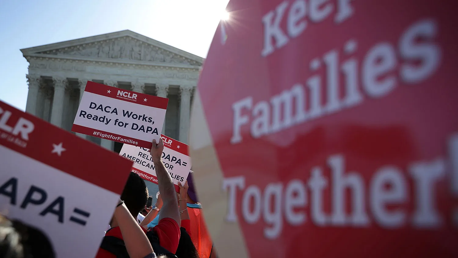 Pro-immigration activists gather in front of the U.S. Supreme Court on April 18, 2016, in Washington.
