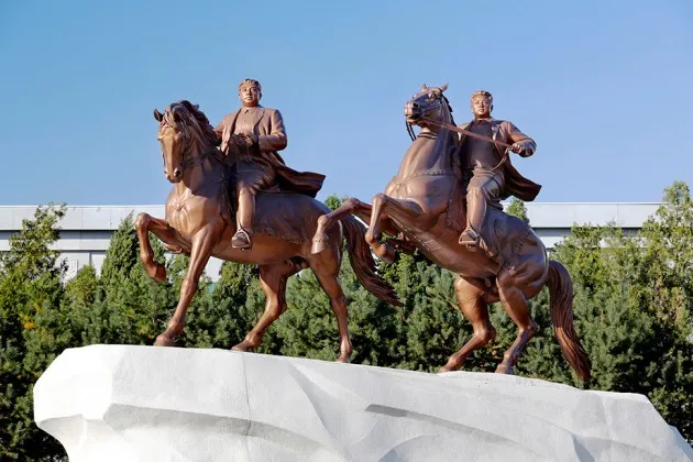 A bronze statue depicting the late North Korean leader Kim Jong Il (right) and his father Kim Il Sung inside the grounds of the Mansudae Art Studio in Pyongyang