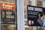 A &quot;Now Hiring&quot; sign outside a Home Depot store in New York.