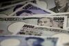 Japanese yen banknotes of various denominations are arranged for a photograph in Tokyo, Japan.