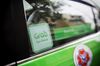 The Grab logo is displayed on a taxi in Bangkok, Thailand, on Friday, March 9, 2018. Grab, the dominant ride-hailing service in Southeast Asia, is close to finalizing a deal to acquire Uber Technologies Inc.'s business in the region and may sign a deal this week or next, according to people familiar with the matter.