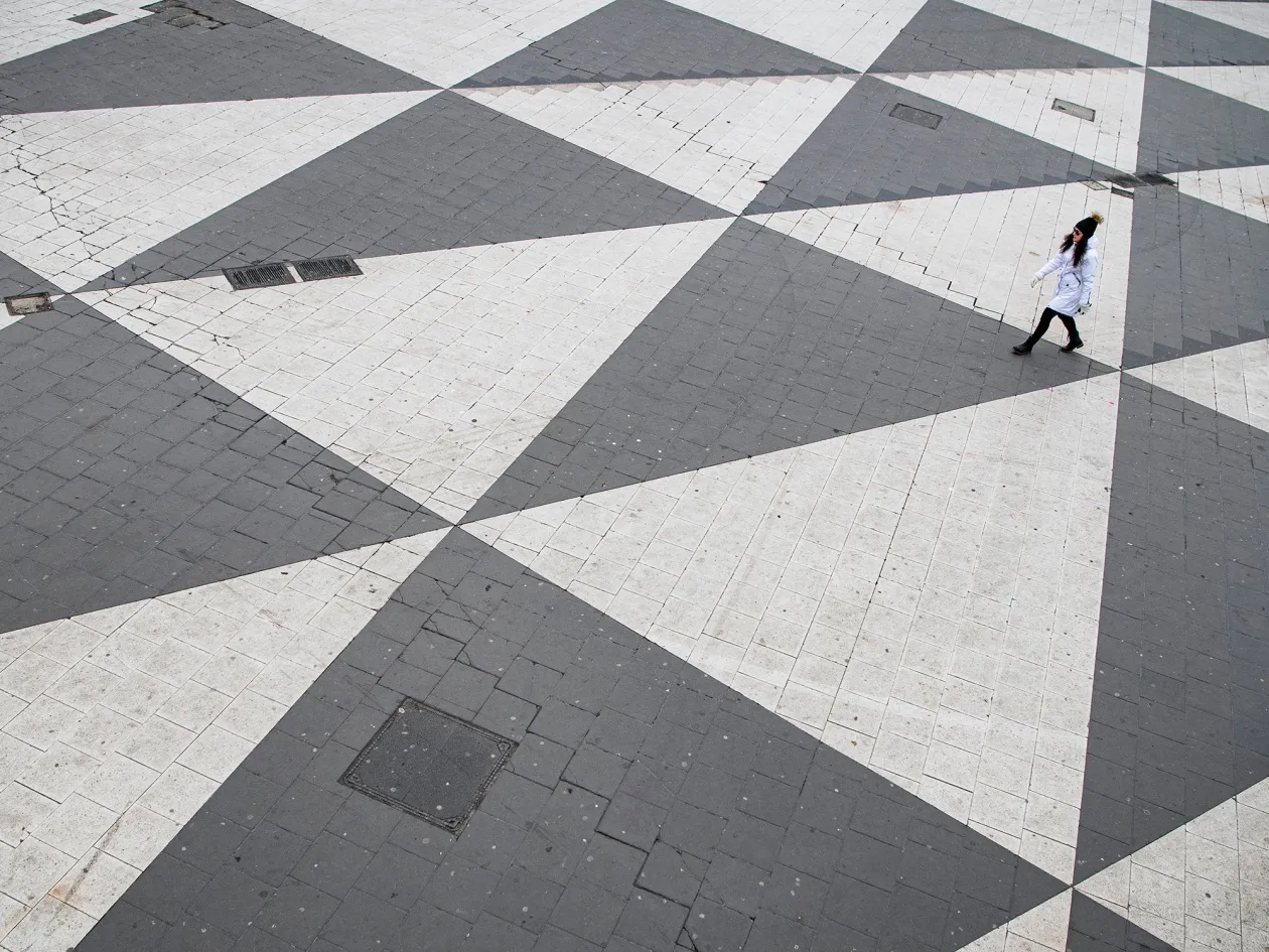 A woman crosses Sergels torg square in Stockholm.