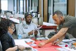 Left to right: IHHE students Kyree Holmes, Marcus Hashim, and Alonzo Goodman work on a team exercise.