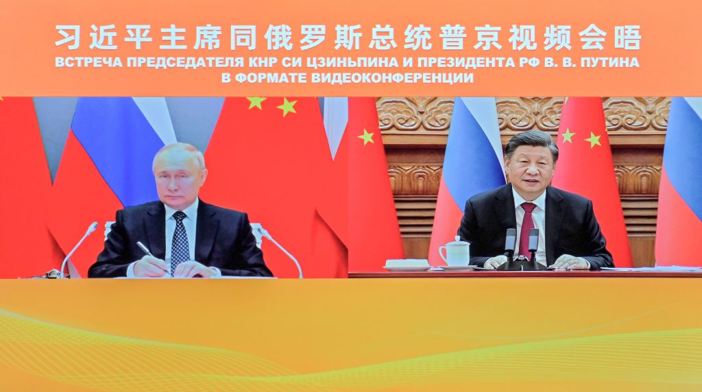 Xi Jinping talks&nbsp;with&nbsp;Vladimir Putin&nbsp;via videolink, in 2022.&nbsp;