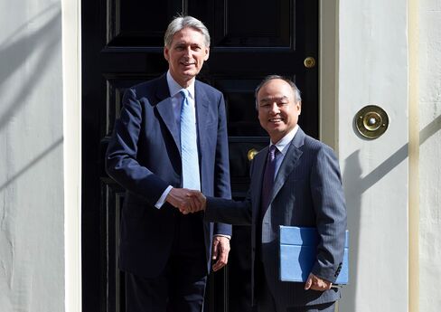 Philip Hammond and Masayoshi Son in London on July 18.