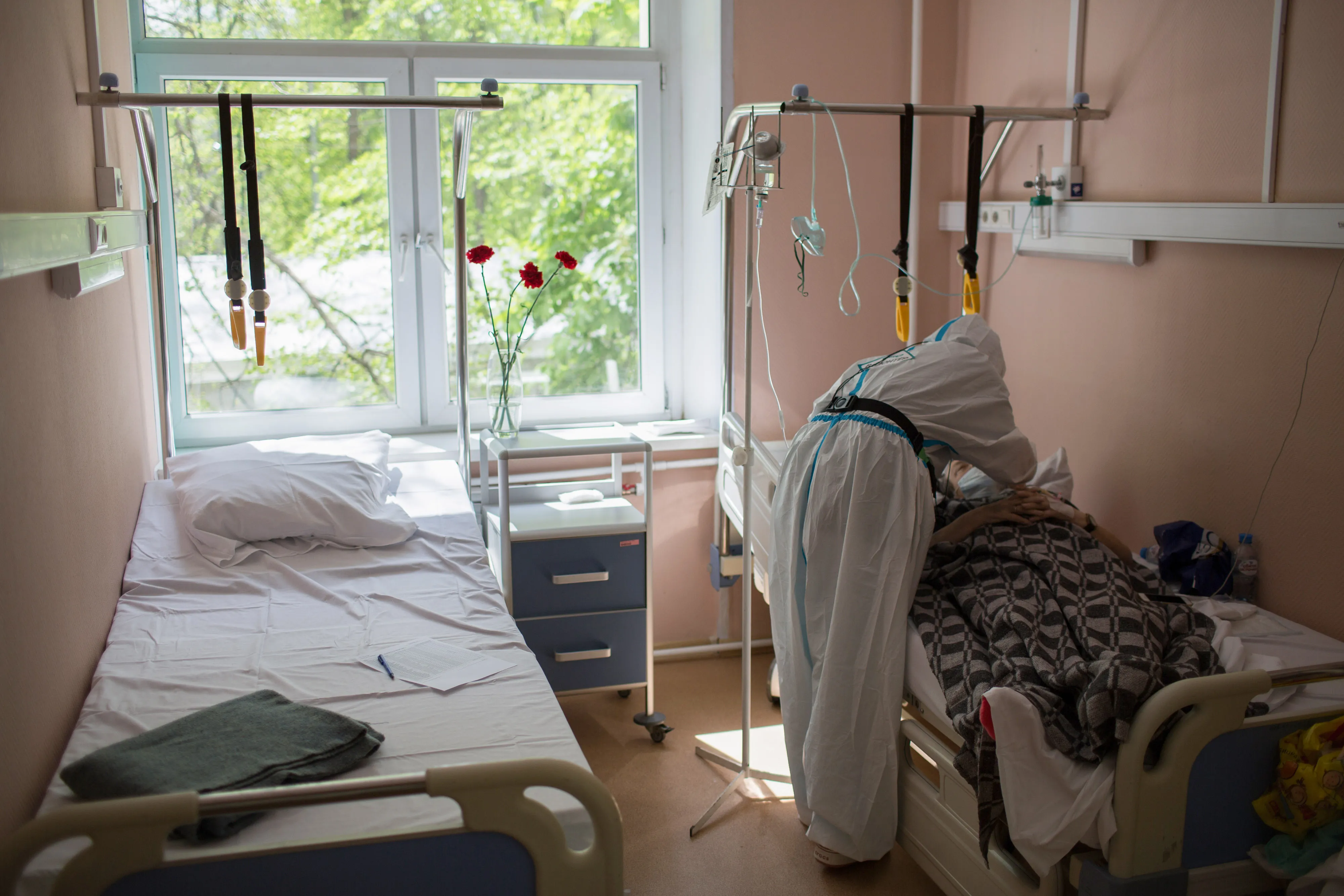 A medical volunteer speaks with a patient&nbsp;inside a hospital in Moscow on May 13.