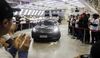 A Tesla Model 3 moves off an assembly line during a ceremony at the company's Gigafactory in Shanghai, on Dec. 30, 2019. 