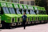 A man walk past Amazon Fresh trucks parked at a warehouse&nbsp;in Inglewood, California. Expanded delivery service during the pandemic now means that most people in food deserts have some access to grocery delivery.&nbsp;