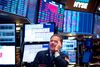Traders work before the closing bell at the New York Stock Exchange (NYSE) on August 14, 2019 in New York City. - It was an ugly day for Wall Street, as stocks plummeted Wednesday amid worsening economic fears after US Treasury yields briefly inverted, flashing a warning sign for a coming recession. But US President Donald Trump once again blamed the Fed for the economic woes and the yield curve inversion, saying the US central bank is a bigger threat than China and is "clueless." The Dow Jones Industrial Average fell 3.1 percent to finish at 25,479.42, a loss of about 800 points -- its worst day of 2019. (Photo by Johannes EISELE / AFP) (Photo credit should read JOHANNES EISELE/AFP/Getty Images)
