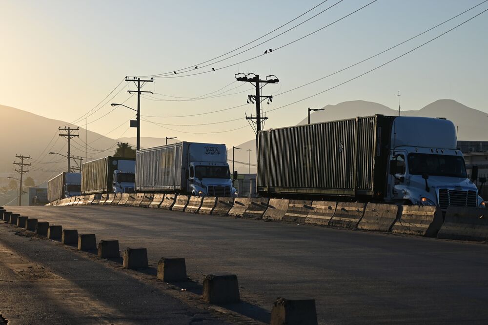 Tractor trailers wait in line at the Otay Mesa Port of Entry, on the US-Mexico border in Tijuana, Baja California, Mexico, on Aug. 30.