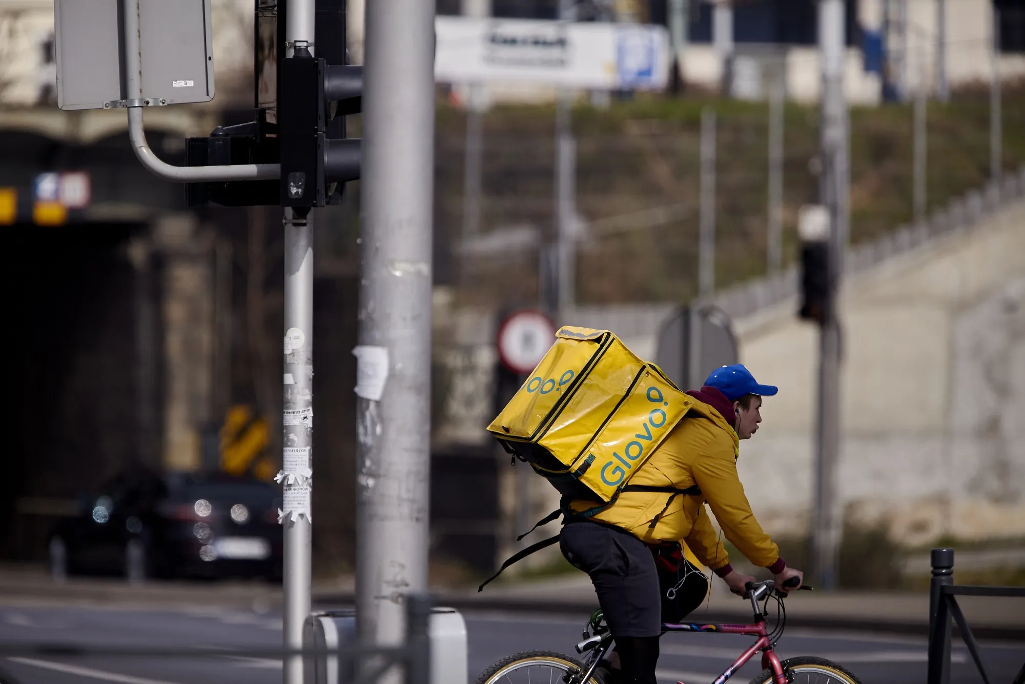 A Glovo courier cycle courier.