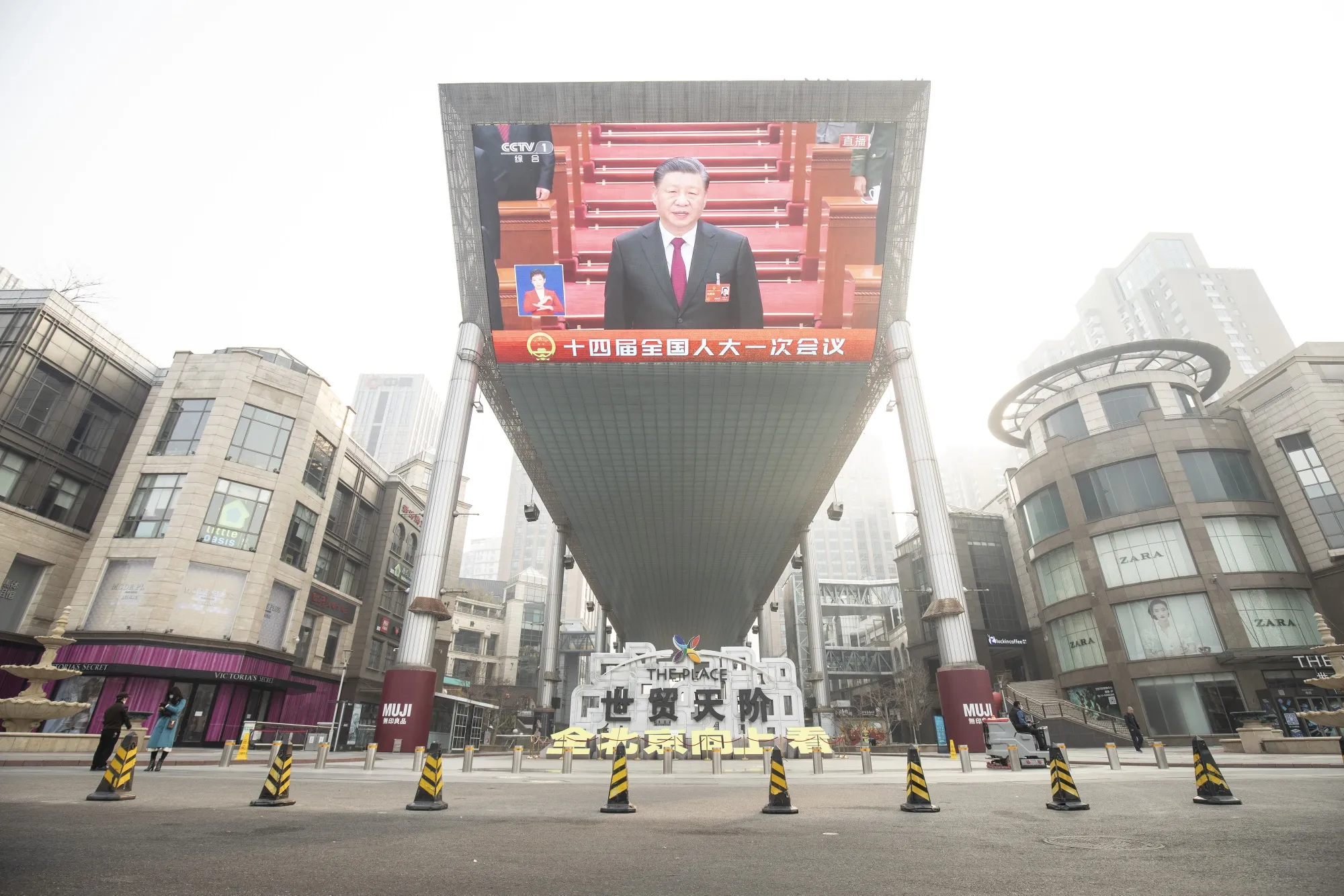 A screen displays a news broadcast of Chinese President&nbsp;Xi Jinping during the opening of the National People’s Congress in Beijing on March 5.