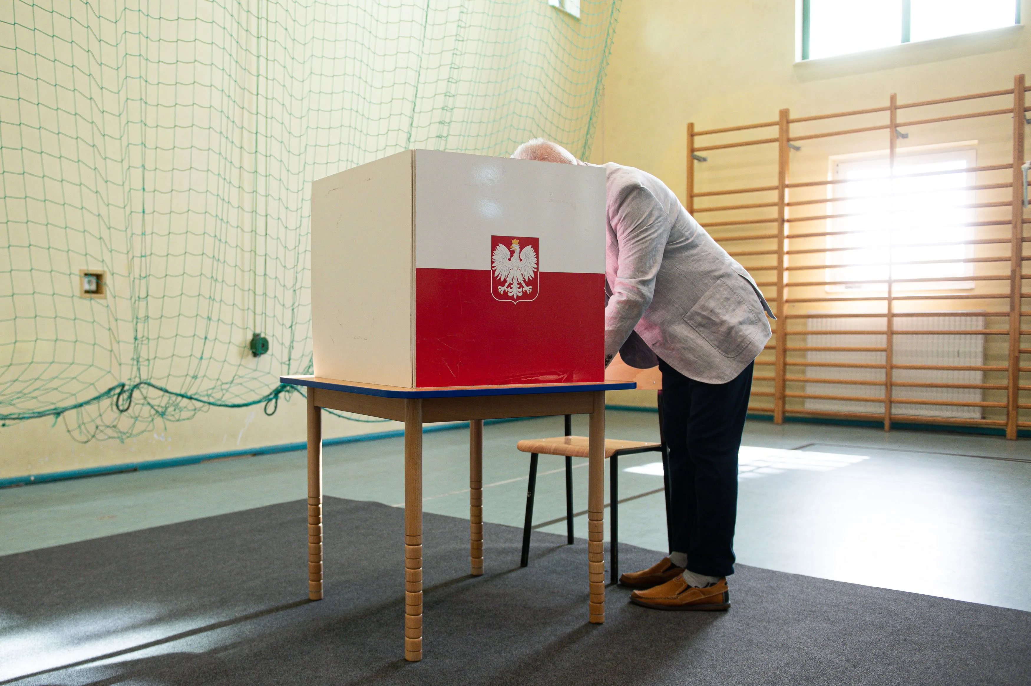 A voter fills out their ballot&nbsp;in Gdansk, Poland in July 2020.&nbsp;