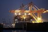 Containers sit stacked on the Jacques Joseph container ship, operated by CMA CGM SA, berthed at a shipping terminal at night in Yokohama, Japan, on Thursday, July 11, 2019. Japan and South Korea plan to meet on Friday over Tokyo’s move to restrict vital exports to its neighbor, but neither has much political incentive to climb down from their worst dispute in decades.