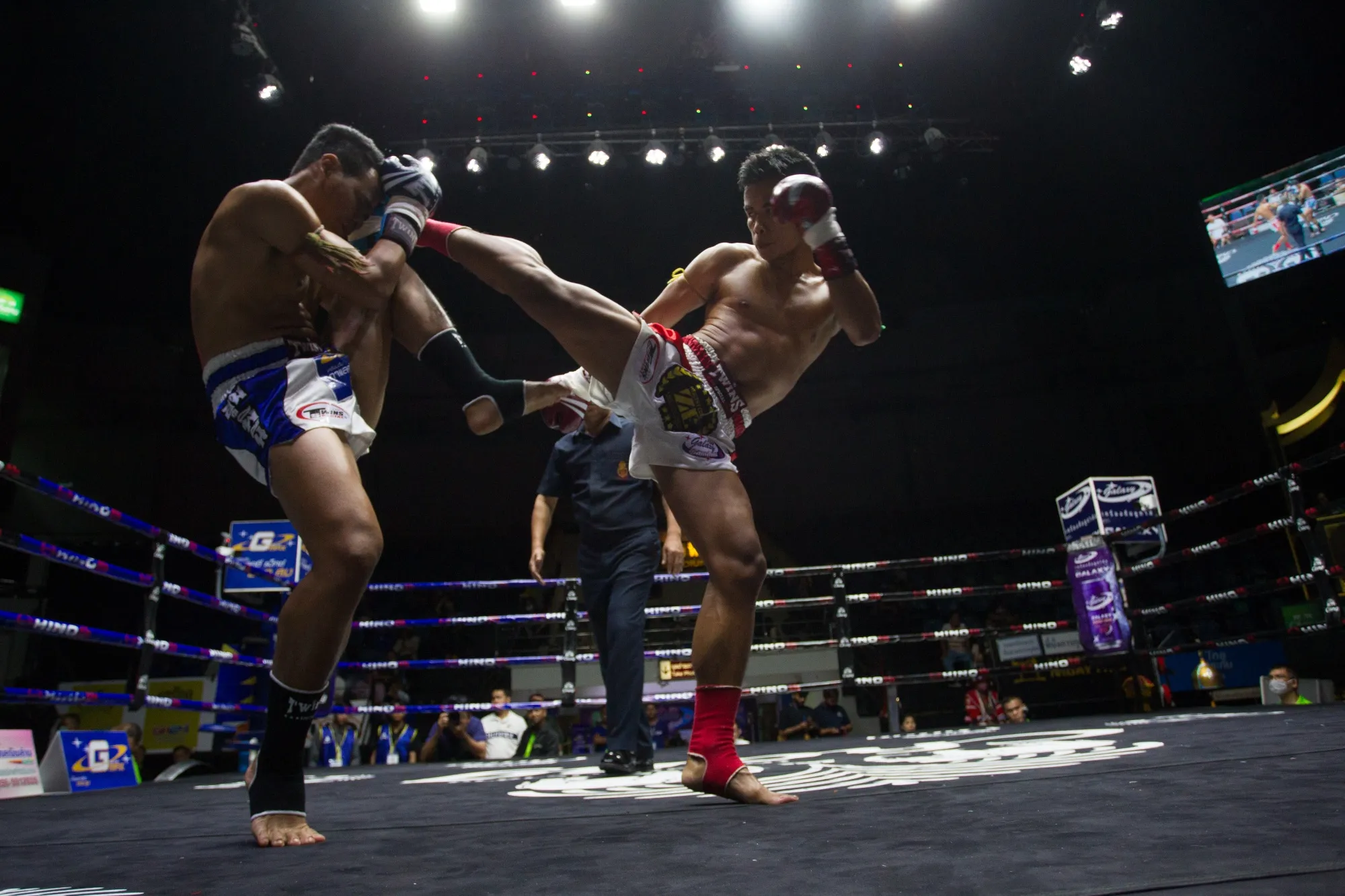 Boxers fight&nbsp;during a Thai Boxing match that was held without spectators as a preventive measure against the spread of the COVID-19 coronavirus at Lumpinee Boxing Stadium.