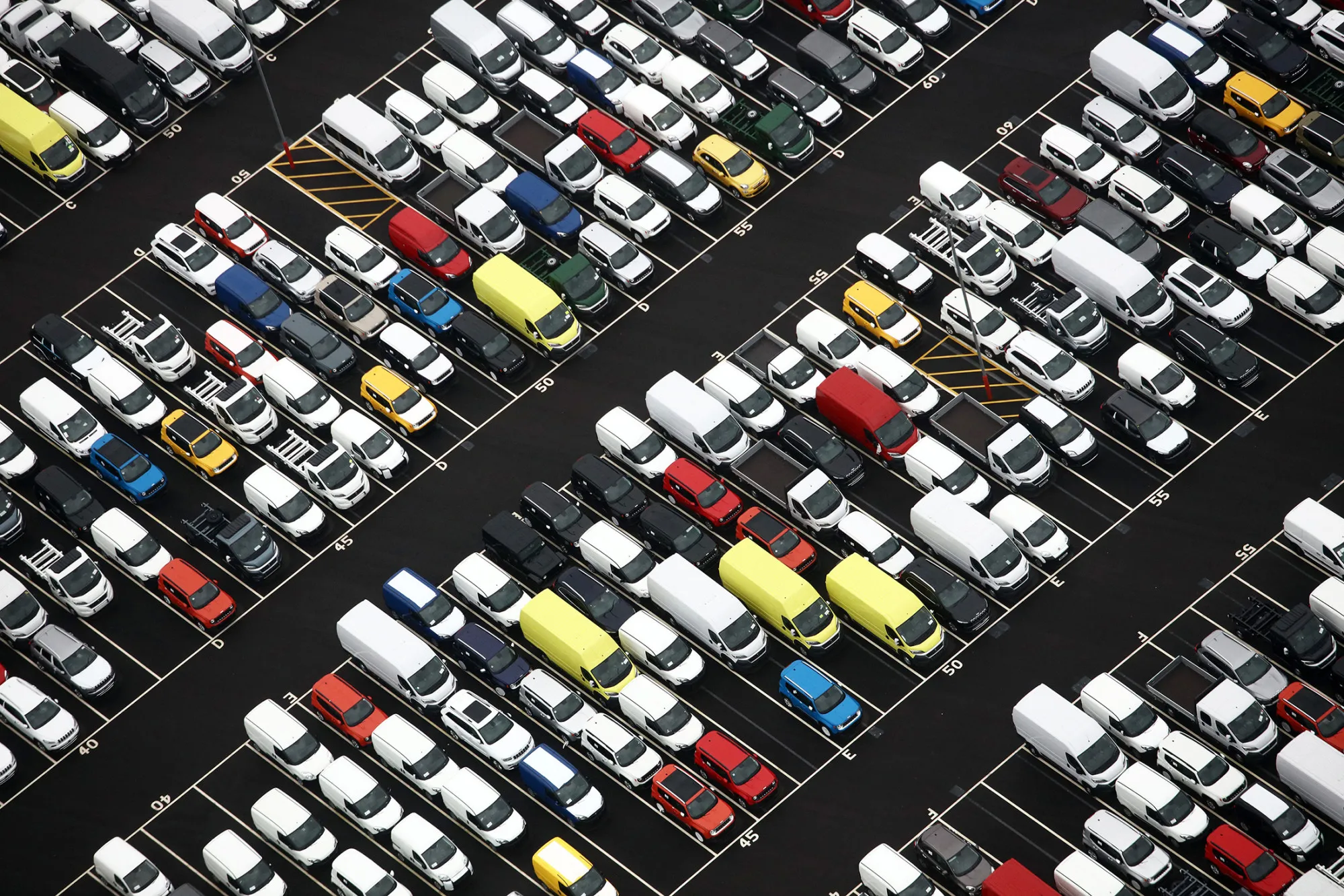 Rows of new automobiles and vans at the Port of Bristol, U.K.
