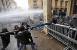 Protesters clash with riot police in Beirut on Jan. 18.