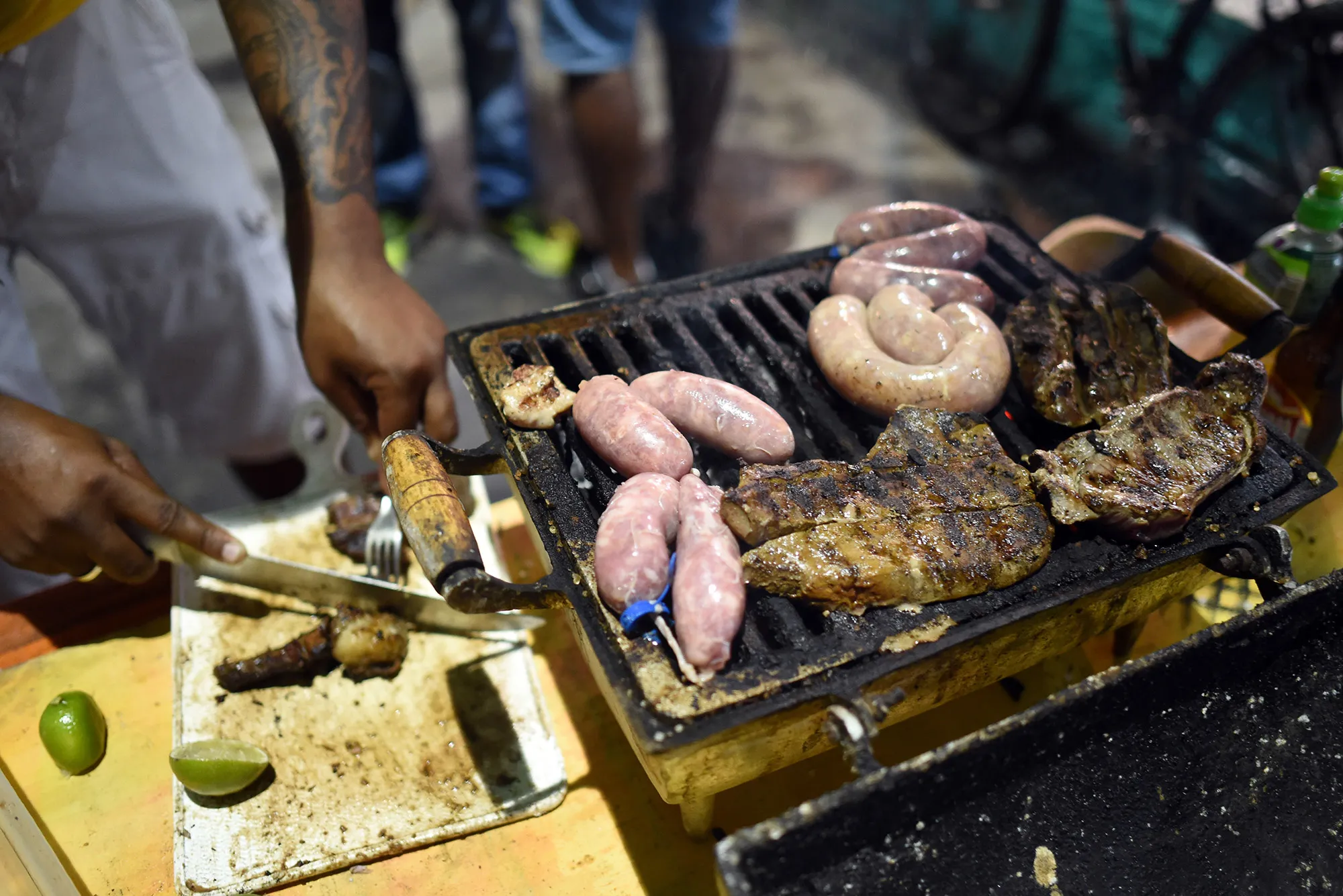 A man prepares a barbecue in downtown Porto Seguro, Brazil