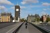 Commuters cross Westminster Bridge in view of the Houses of Parliament and Elizabeth Tower, also known as Big Ben, in London, U.K., on Monday, May 11, 2020. U.K. Prime Minister Boris Johnson will flesh out his plan for lifting the U.K. lockdown in Parliament as he seeks to get more people back to work, even as resistance from politicians and labor unions laid bare the hurdles facing the government as it tries to kickstart the economy.