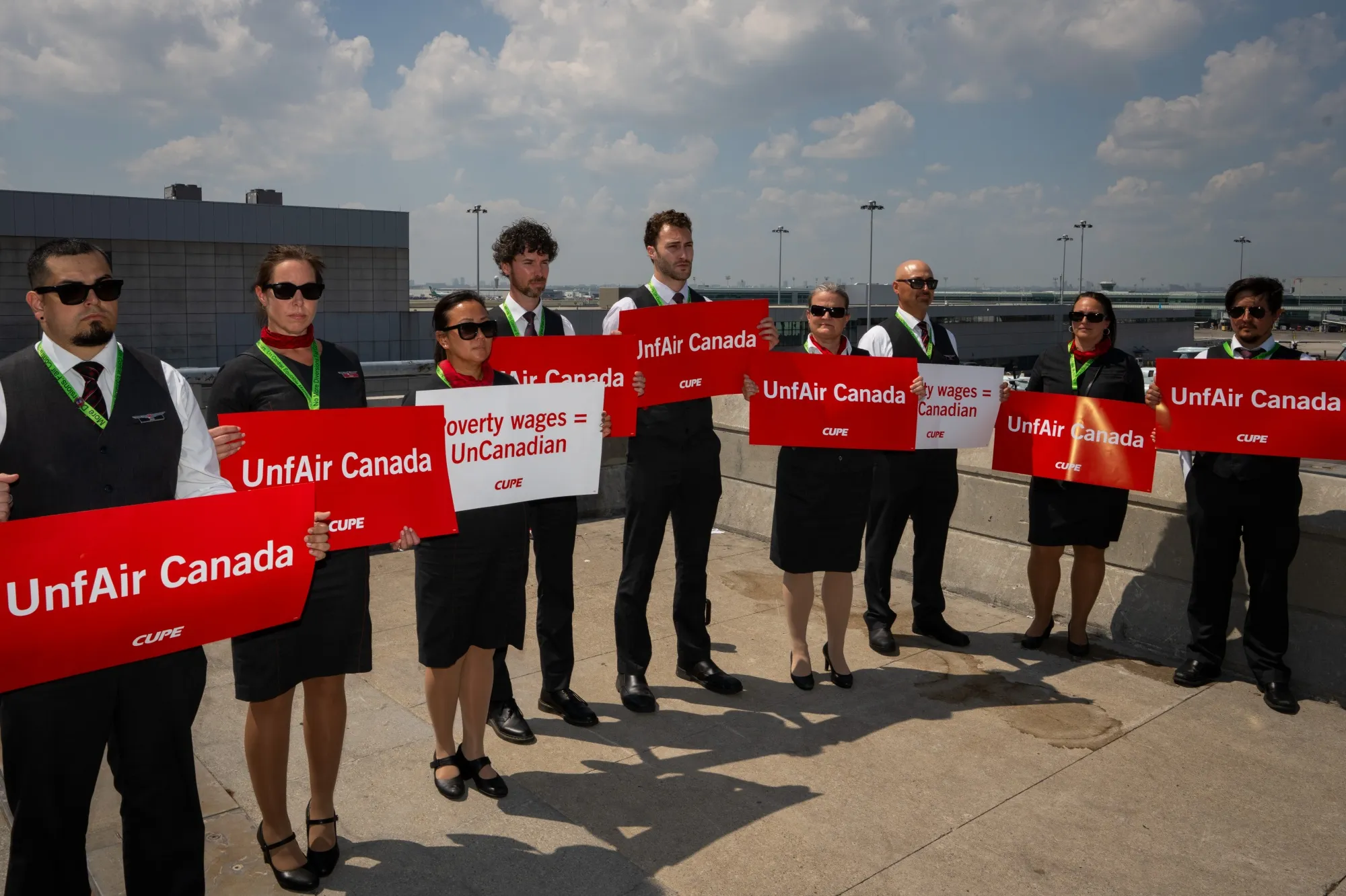 Air Canada flight attendants during a demonstration at Toronto Pearson International Airport in Mississauga, Ontario on Aug. 11.